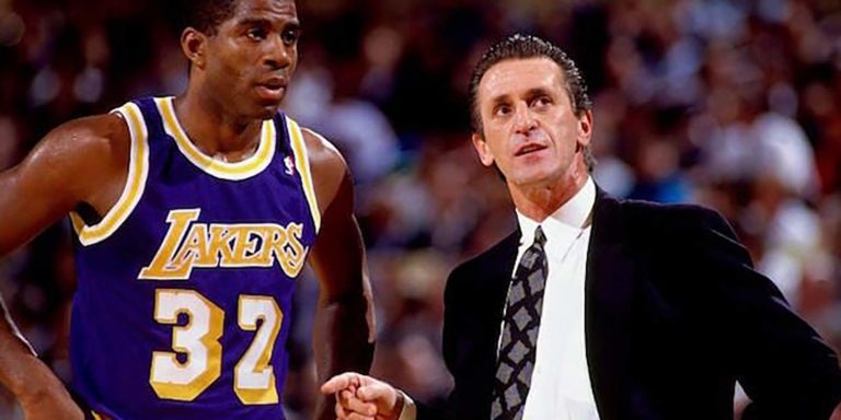 Coach Pat Riley of Los Angeles Lakers coaching Magic Johnson aligned to his willing sales plan and team strategy to create a win.