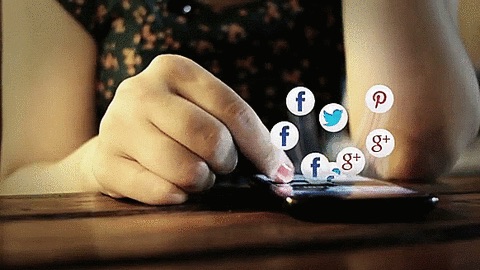 Woman thumbing through social platform notifications from Facebook, Twitter, and Google Plus