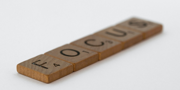 The word focus spelled out with Scrabble letters