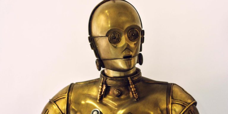C3PO looks off screen to the left