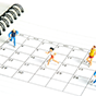 Four running figurines stand on a calendar