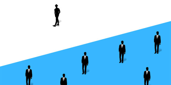 Seven people in suits stand inside of a rectangle that is divided by a blue triangle