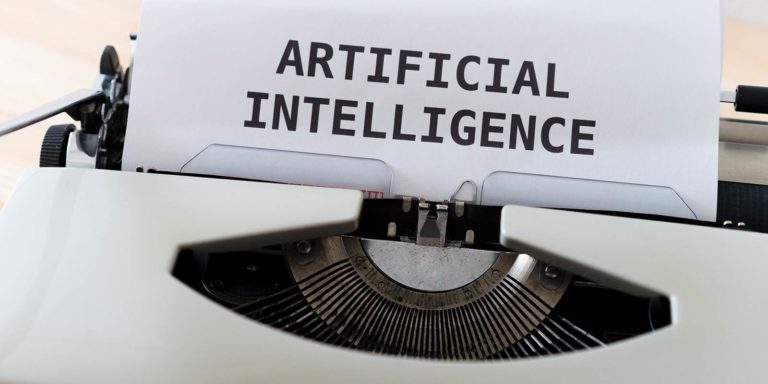 A typewriter spells out Artificial Intelligence.