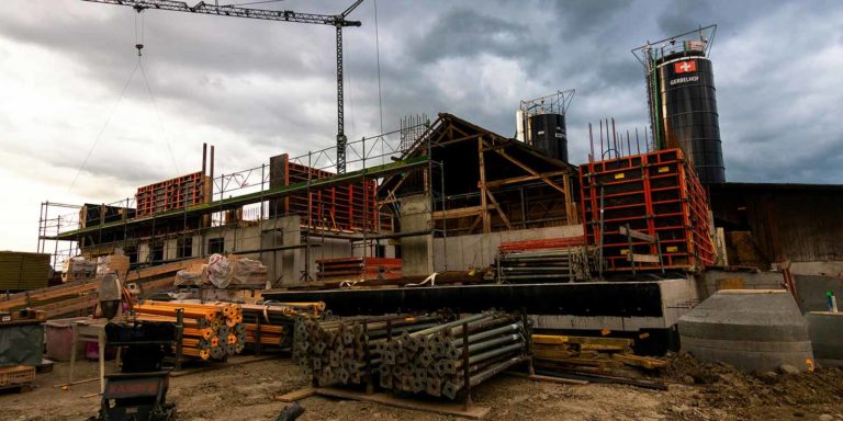 A construction site shows a new building being built.